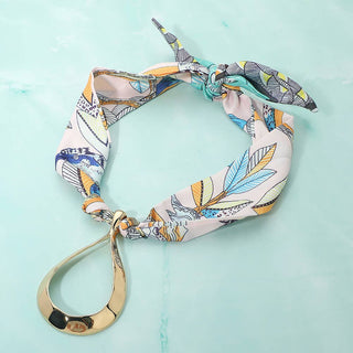 Scarf necklace with a gold teardrop pendant 