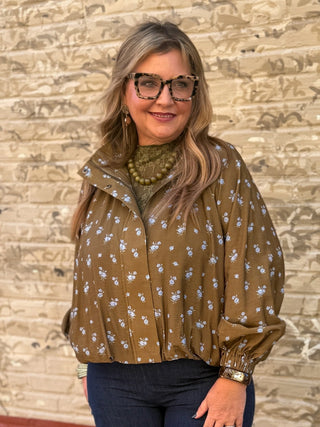 short light weight jacket. green with little blue flowers