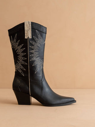 Black cowboy boot with decorative stitching.