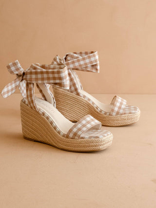 Woven wedge sandals with gingham straps.