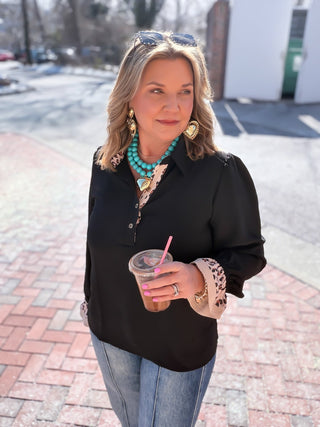 black blouse with leopard trim