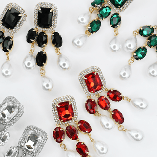 Earrings  with red, green, and black gemstones 