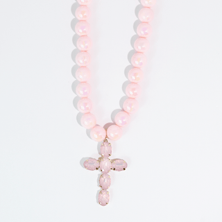 Necklace with pink beads and a cross pendant made by treasure Jewels.