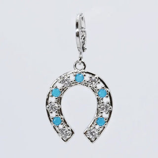 Horseshoe-shaped pendant with blue stones and clear crystals 