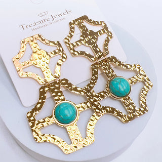 Gold earrings with turquoise stones.