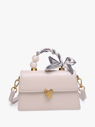 Beige handbag with decorative bow and pearl accents 