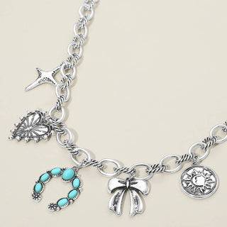 Silver charm necklace with various charms.