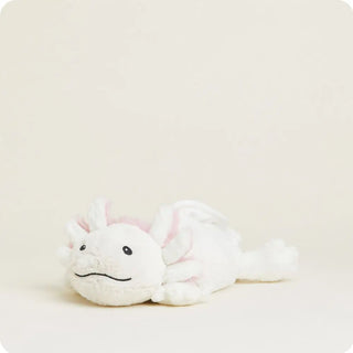 A white plush axolotl warmie with pink gills and a simple stitched black mouth lying down.