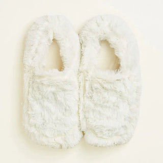 Pair of white fluffy warmie slippers.