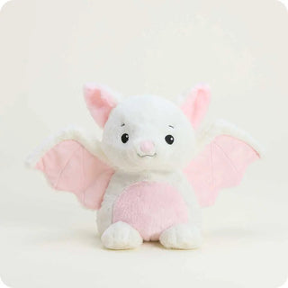 A cute white plush bat warmie with soft pink wings, pink inner ears, and a pink belly.