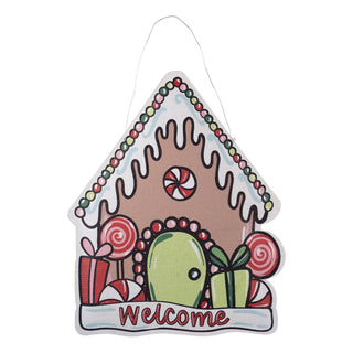 Decorative gingerbread house-shaped sign with a cactus and candy decorations 