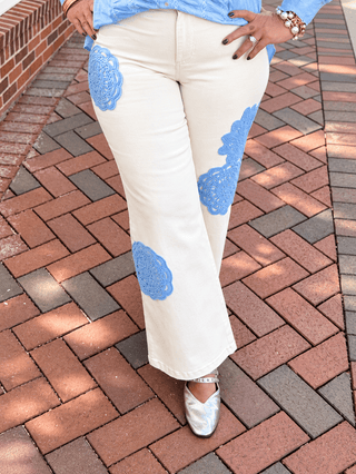 Whispering Petals Pants feature a flattering wide-leg, high-waist silhouette with intricate floral lace appliques