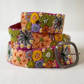 Colorful embroidered belt with floral patterns.