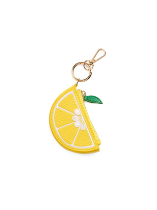 Yellow lemon-shaped bag charm/keychain with a green leaf.