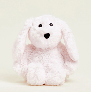 A plush pink bunny warmie with a soft texture.